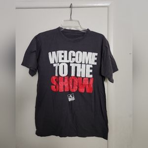 Plain Black T shirt with "Welcome to the Show" text on the front